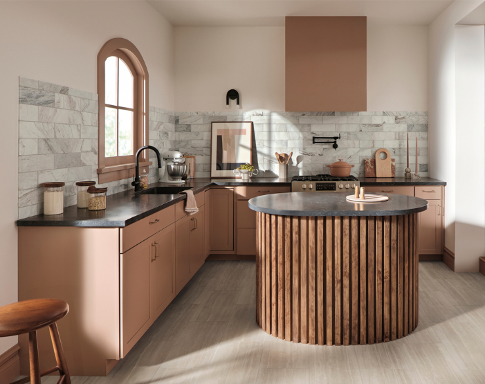 Black countertops in a kitchen with terracotta cabinetry