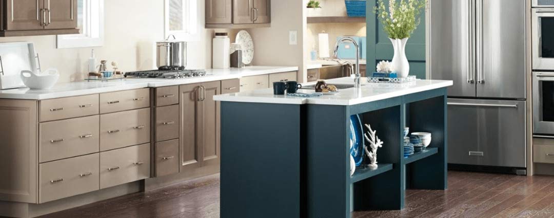 coastal kitchen room scene with cabinets and countertops